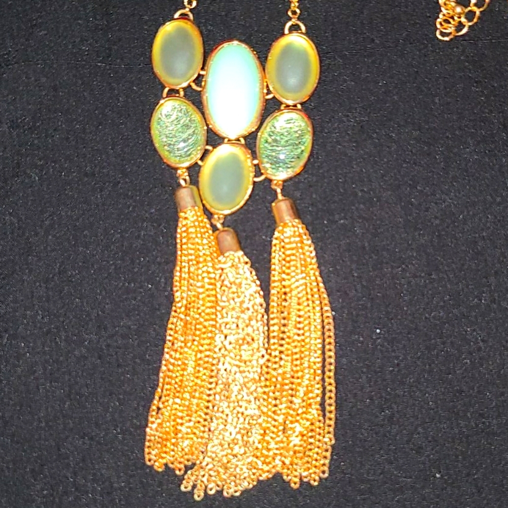 Gold colored with green stones costume jewelry